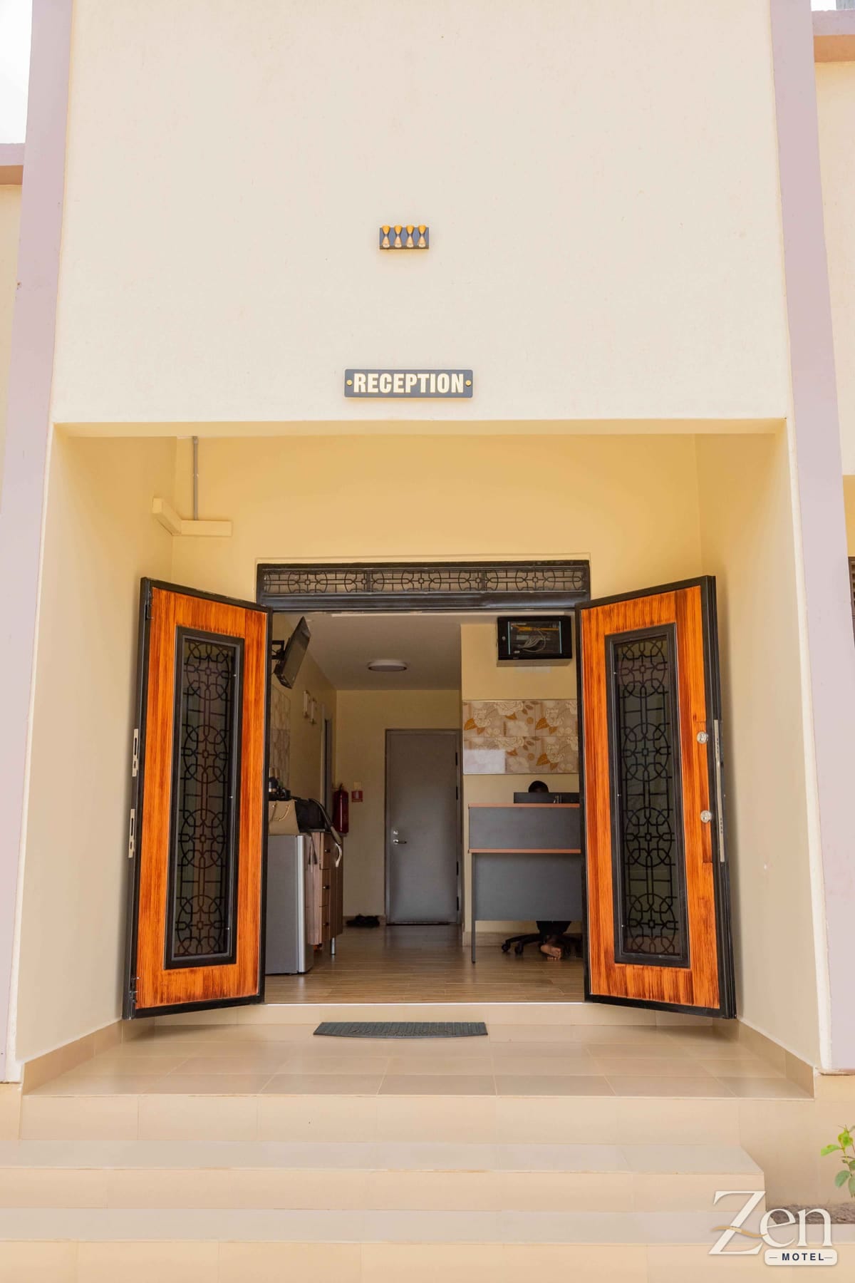 Carved timber doors open onto the Zen Motel reception